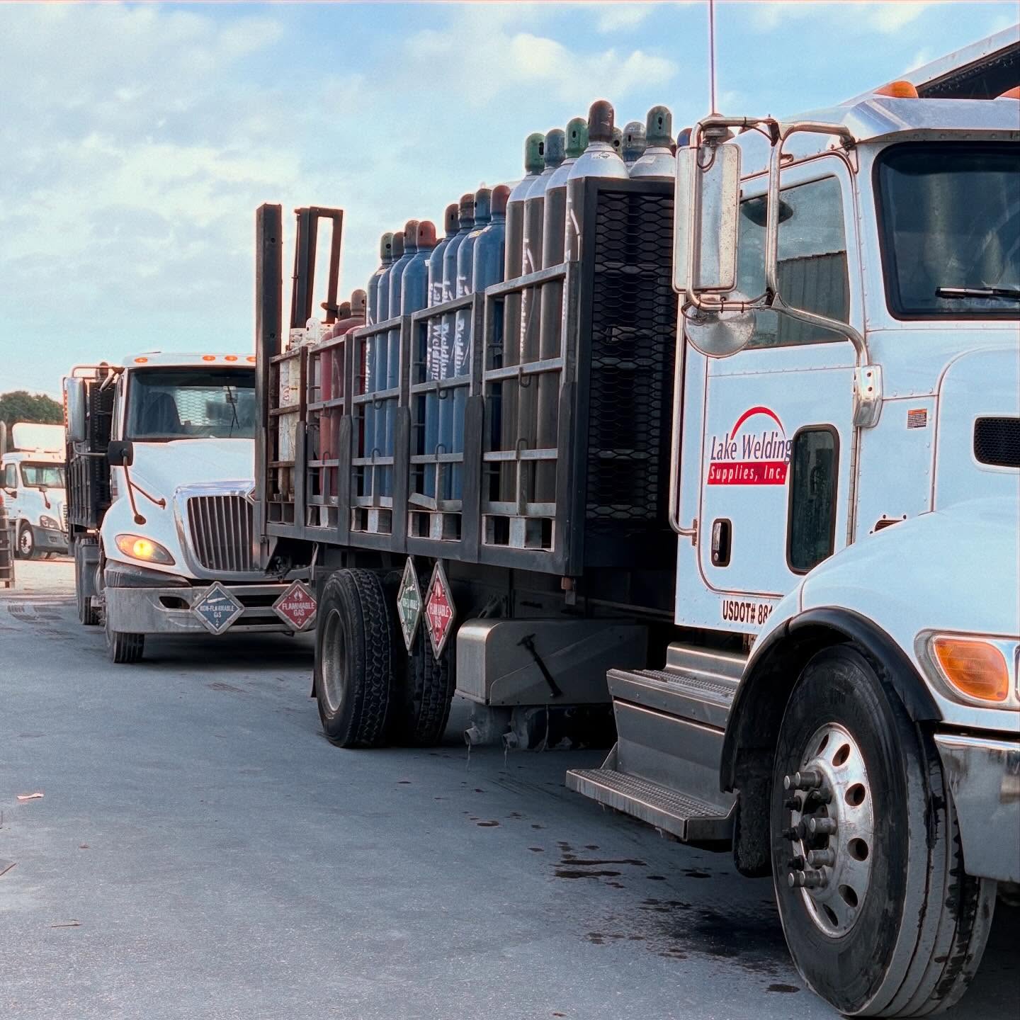 Lake Welding Supplies trucks carrying industrial gas cylinders